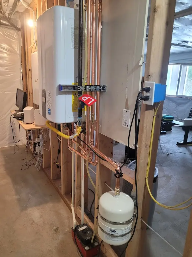 Licensed plumber repairing a kitchen sink in Fayette