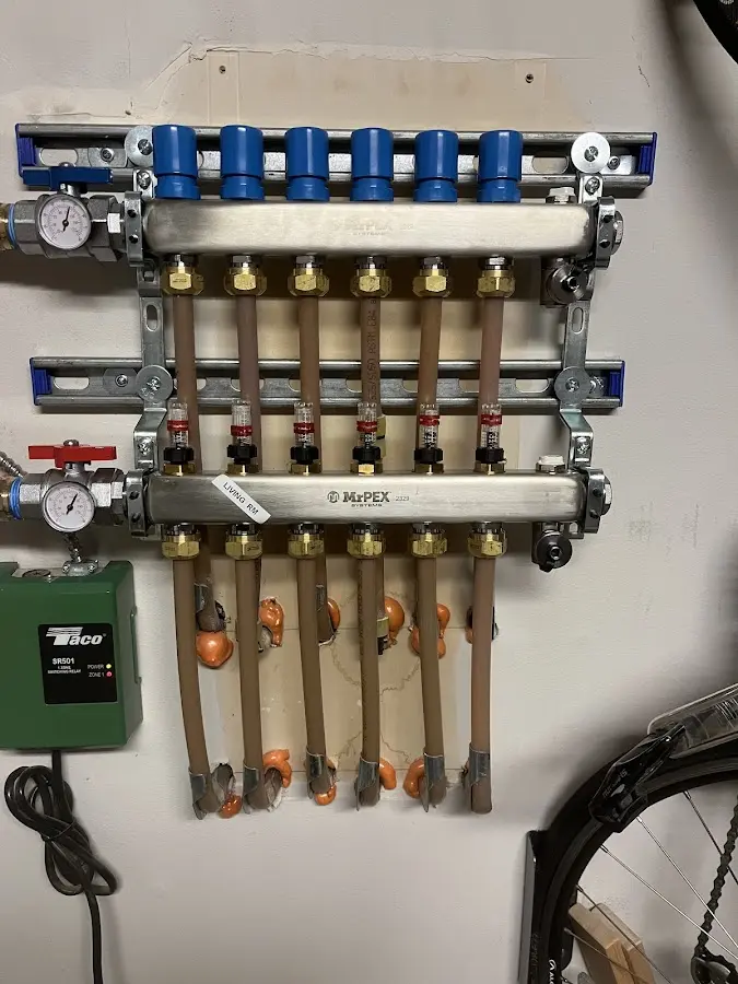 Plumber performing Water Heater Repair at a residential property in Fayette